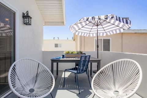 Outdoor dining area on the balcony.