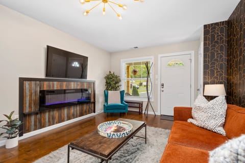 Dogwood's living room offers comfortable seating and a TV.