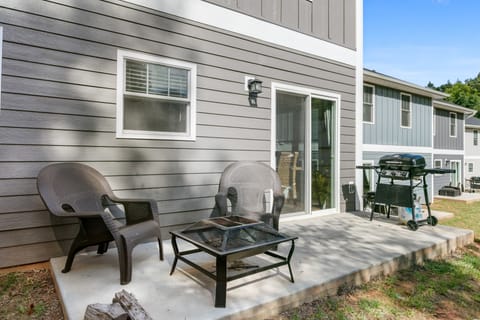 The back patio at Cyrpress features a firepit.