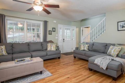 Relax and entertain in this spacious living room with ample seating for all.