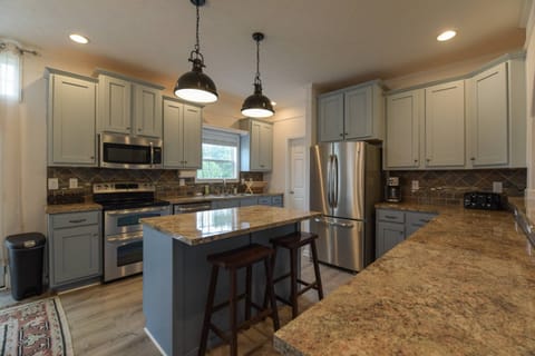 Features stainless steel appliances.