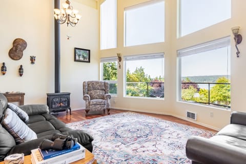 A brightly illuminated living room showcasing a cozy fireplace.