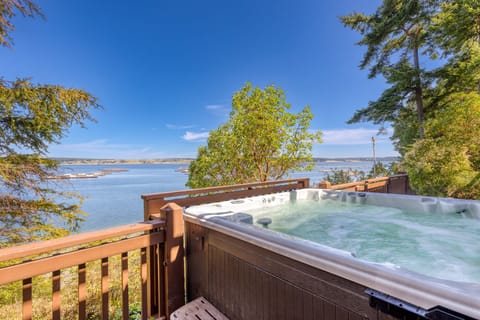 Unwind in this hot tub haven perched on the deck!