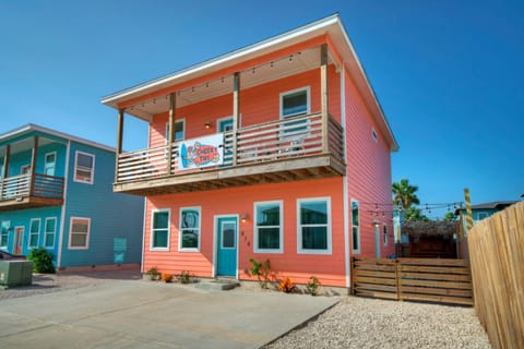 Coral colored beach house in a prime location.