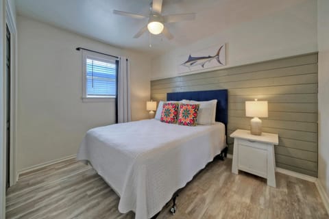 Primary bedroom features a queen bed.