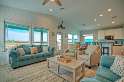 Sunlit living room through huge windows.