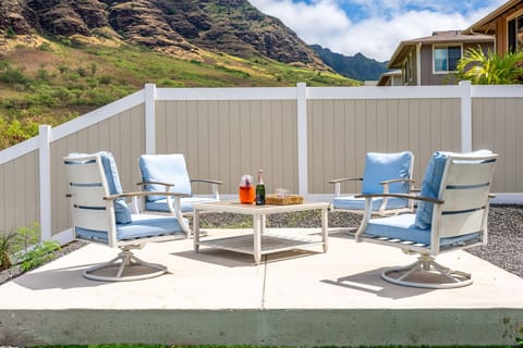 A picturesque backyard haven with an expansive patio and mesmerizing mountain landscapes.