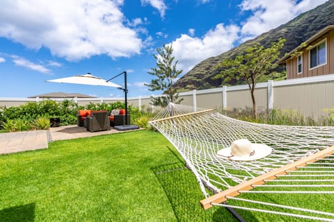 Backyard oasis with a hammock and comfortable seating.