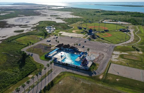 Nearby public pool and sports fields.