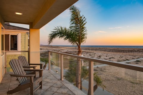 Private balcony and deck with ocean and sunset views.