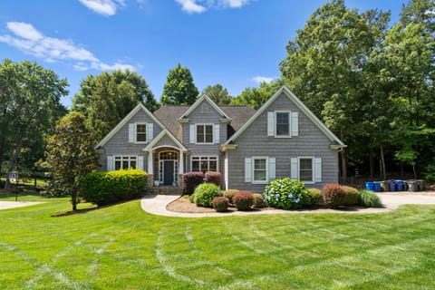 Spacious yard with stone firepit for a blissful gathering.