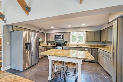 Upgraded kitchen equipped with bar seating for four.