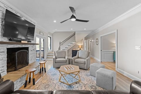 Main level living room with natural light flowing in through the windows.