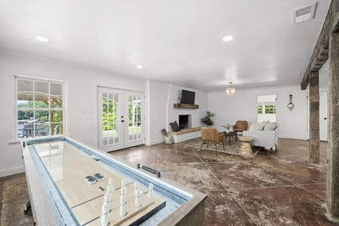 Lower Level-Indoor fun awaits thanks to the shuffleboard.