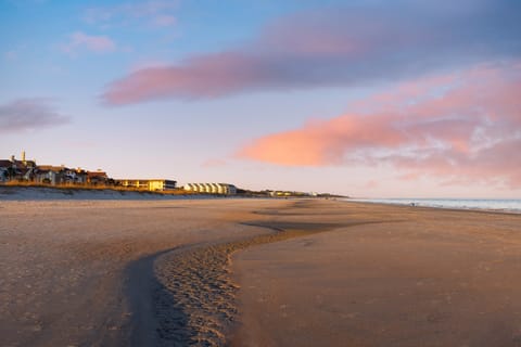 Take a sunset stroll on the beach.