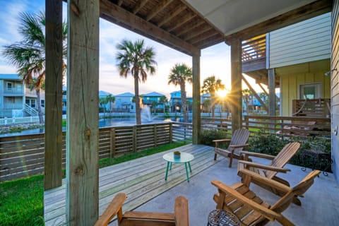 Back patio with seating and a view of the pond.