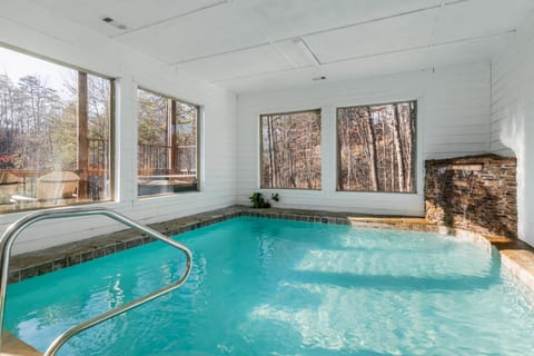 Indoor pool with stunning forest views.