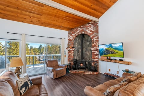 Cozy up by the large stone fireplace in the living room.
