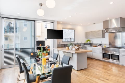 Gourmet chef's kitchen and dining area with modern elegance.