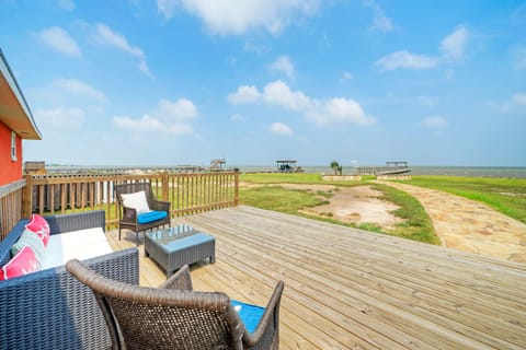 Relax on the patio while enjoying a stunning beach view.