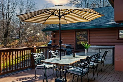 Spacious deck with outdoor dining and grill for al fresco feasts.