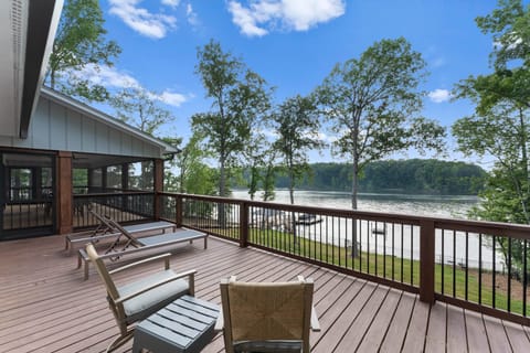 Back deck with seating and loungers to enjoy the view.