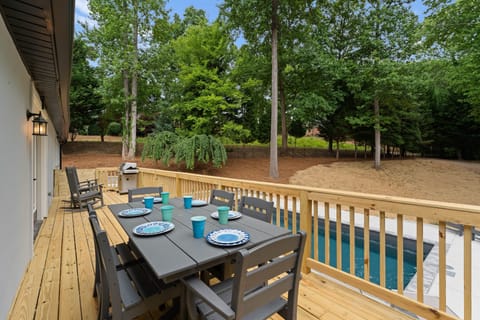 Back deck with table seating for 6 along with 2 rockers & a grill, propane provided.