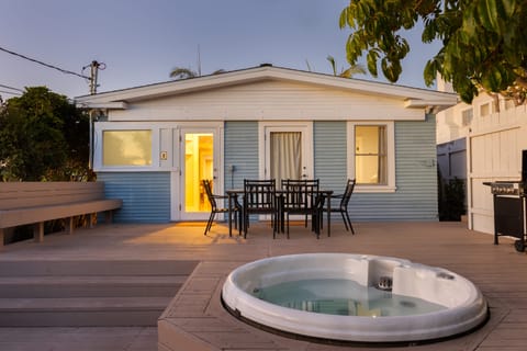 Spacious deck with a hot tub.