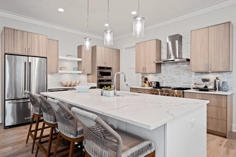 Contemporary open-concept living with a state-of-the-art kitchen.