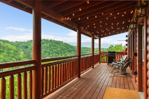 Relax on the balcony with comfortable seating, stunning mountain views, and a BBQ grill.