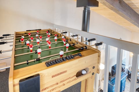 Loft features a foosball table.