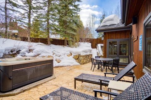 Just outside of the pool house and gym is the outdoor hot tub.  Surrounded by trees, this is a truly magical experience!