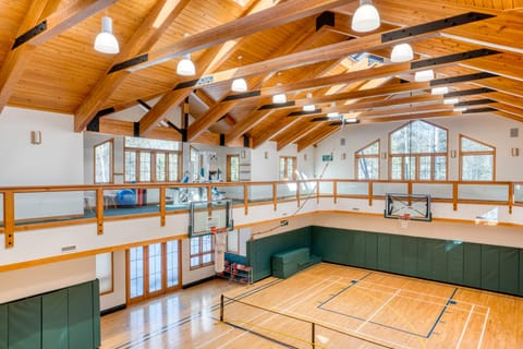 Private gym with a tennis/basketball court, running/walking path, and fitness equipment.
