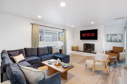Bedroom 2 features a queen bed and TV.