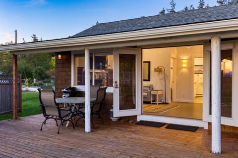 Outdoor patio with a BBQ grill and dining table—perfect for alfresco meals.