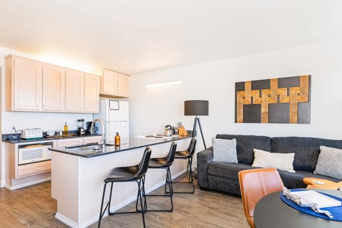 Fully equipped kitchen with barstool seating. (Cayucan Bungalow 230)