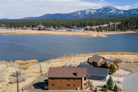 A sweeping aerial reveals the home’s unique position with Big Bear Lake and majestic mountains as your backdrop.