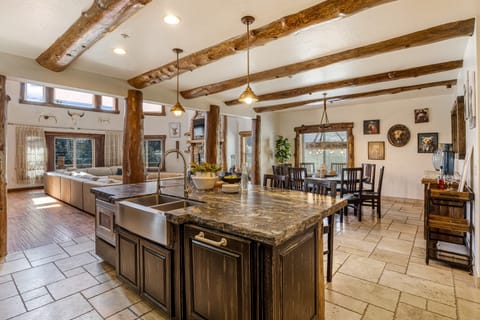 This chef’s kitchen blends rustic style with modern flow and functionality.