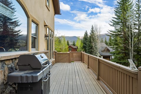 Uncovered deck with BBQ grill.