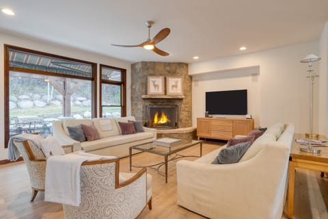 The living room features a TV and a fireplace for a cozy retreat.