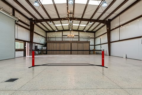 Barn area with a pickleball net.