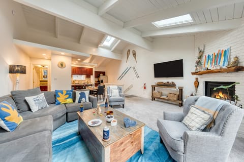 Bright and inviting living room with fireplace.