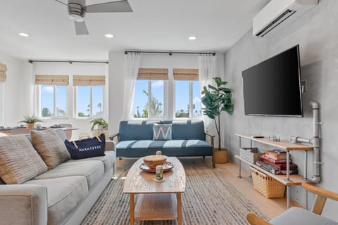 Stylish living room with comfy seating and natural light.