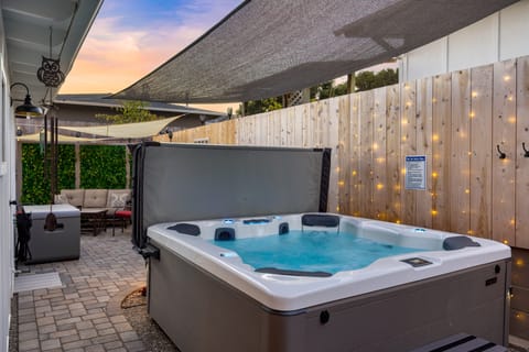 Private hot tub with sun shade.