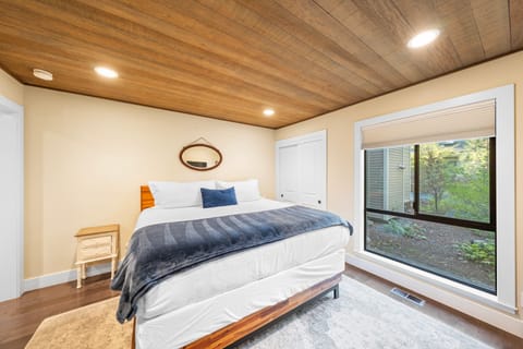 The primary bedroom features a king bed, TV, and an ensuite bathroom.