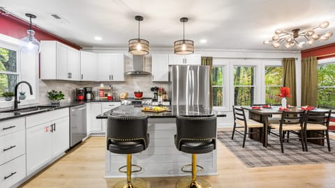 Sleek, modern kitchen with barstool seating.