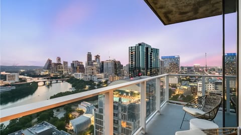 Enjoy sweeping city views from the balcony—perfect for morning coffee or sunsets. (The Emma Penthouse)