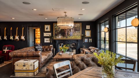 Rock-inspired living room with luxe leather seating and bold art.