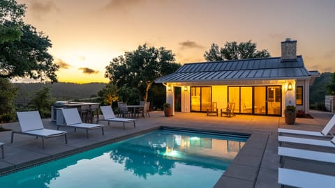 Unwind by the pool with a stunning sunset and your private pool house.