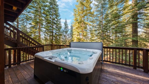 Private hot tub on deck overlooking the forest.
